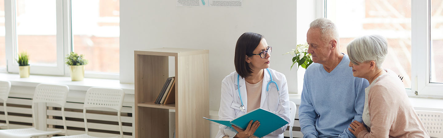 A couple speaking to a doctor